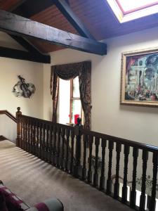 a staircase in a house with a window at Mickering Barn in Aughton