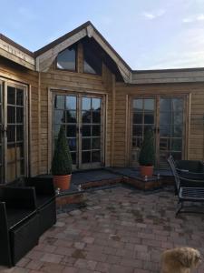 a screened in porch of a house with windows at Mickering Barn in Aughton