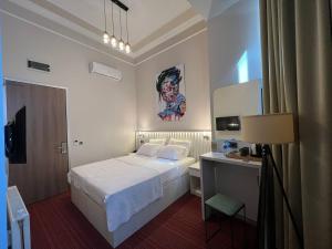 Кровать или кровати в номере Rafinn Hotel +37 фотографий