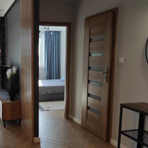 Легло или легла в стая в Apartament J Towers z widokiem na jezioro