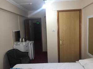 Postel nebo postele na pokoji v ubytování Paris Hotel