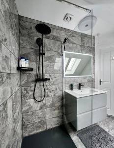 a bathroom with a shower and a sink at North Colchester Homestay in Colchester