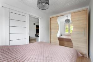 Posteľ alebo postele v izbe v ubytovaní Gdynia Mare Apartment