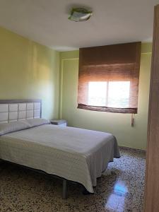 Ένα ή περισσότερα κρεβάτια σε δωμάτιο στο Precioso apartamento a dos pasos de playa y centro