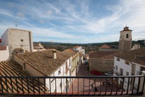 a view of a town with buildings and a clock tower at Apartamento Paco 3 cerca de Valencia in Benafer