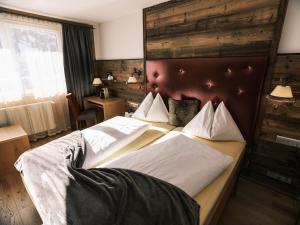 Кровать или кровати в номере Hotel Kristall