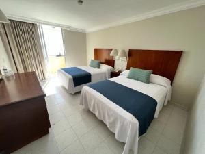 Postel nebo postele na pokoji v ubytování Hotel Sands Arenas + 37 fotografií