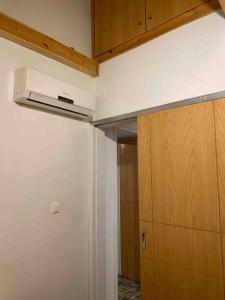 a kitchen with a ceiling fan and a closet at Aspa's Traditional House in Didyma