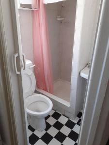 a bathroom with a toilet and a shower at The Coastal Bay Hotel in Blackpool