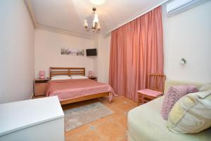 Postel nebo postele na pokoji v ubytování Apartment Plazza Rafailovici