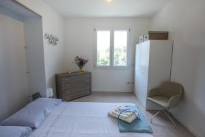 Postel nebo postele na pokoji v ubytování Maison Emozioni