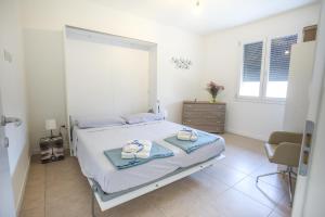 Postel nebo postele na pokoji v ubytování Maison Emozioni