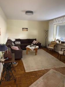 a living room with a couch and a coffee table at Ferien-/Monteurwohnung Linge (Marienheide) in Marienheide