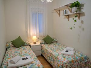 מיטה או מיטות בחדר ב-Apartment PICNIC SANTS