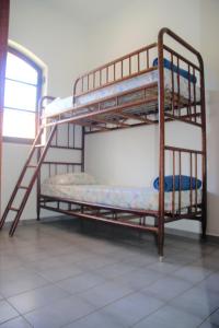 a couple of bunk beds in a room at Marujo Hostel in Ubatuba