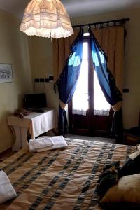 Säng eller sängar i ett rum på La Corte del Barbio