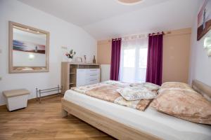Posteľ alebo postele v izbe v ubytovaní Apartments Meri - 5