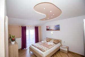 Posteľ alebo postele v izbe v ubytovaní Apartments Meri - 5