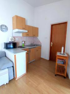 Kuchyň nebo kuchyňský kout v ubytování Kaštelina apartments