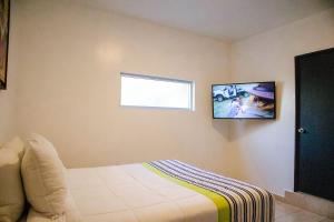 TV a/nebo společenská místnost v ubytování Donjuan By Melida Hotel