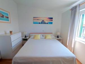 Postel nebo postele na pokoji v ubytování Kaštelina apartments