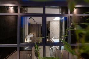 a bathroom with a large window and a sink at VELVET rooms & more in Zadar