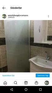 a bathroom with a white cabinet and a sink at Serenity Bungalow Çamyuva in Agva