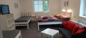 Postel nebo postele na pokoji v ubytování Pension Apartmány Harrachov 288