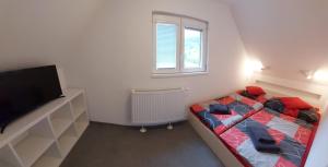 Postel nebo postele na pokoji v ubytování Pension Apartmány Harrachov 288