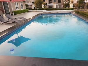 a swimming pool with blue water in a house at 2Bedroom Luxury hotel apartment Fourways in Johannesburg