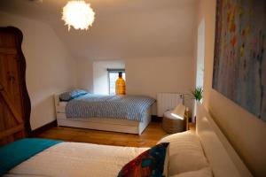 Cosy Apartment/ Explore The Area/Enjoy our Pub客房内的一张或多张床位