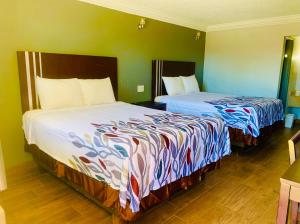 Posteľ alebo postele v izbe v ubytovaní Budget inn and suites