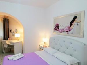 A bed or beds in a room at Bella Matera