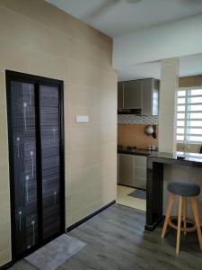 A kitchen or kitchenette at DARUL AMAN Homestay Jitra