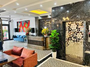 a living room with a couch and a table at Sapa Grand Hills Hotel Apartments in Sa Pa