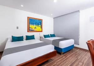Hotel Basan Plaza客房内的一张或多张床位