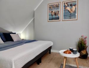 Posteľ alebo postele v izbe v ubytovaní Apartament GRAY CRANE