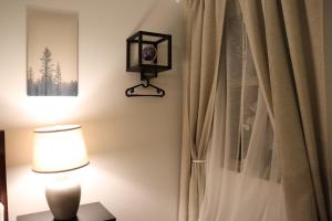a room with a lamp and a curtain at Cozy Getaway with Ocean View and Private Entrance! in Gualala