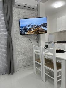 Kuchyň nebo kuchyňský kout v ubytování Apartments MASIMO