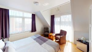 Postel nebo postele na pokoji v ubytování DuinHotel Texel