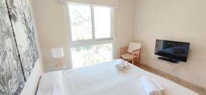 TV a/nebo společenská místnost v ubytování Apartamento Estrella del Mar by DENIA COSTA