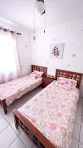 Ένα ή περισσότερα κρεβάτια σε δωμάτιο στο Anthea Gardens - Cosy Condo