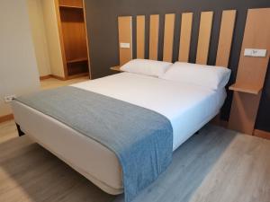 Postel nebo postele na pokoji v ubytování Smart Hotel La Sagra