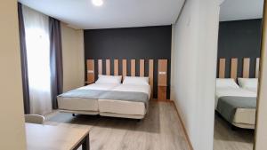 Postel nebo postele na pokoji v ubytování Smart Hotel La Sagra