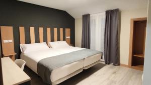 Postel nebo postele na pokoji v ubytování Smart Hotel La Sagra