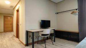 TV a/nebo společenská místnost v ubytování Smart Hotel La Sagra