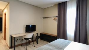 TV a/nebo společenská místnost v ubytování Smart Hotel La Sagra