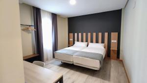 Postel nebo postele na pokoji v ubytování Smart Hotel La Sagra