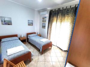 Postel nebo postele na pokoji v ubytování Scala dei Turchi Apartment