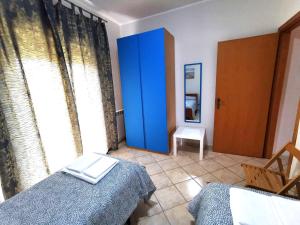 Postel nebo postele na pokoji v ubytování Scala dei Turchi Apartment